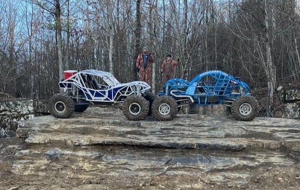 Buggies working up a rock ledge