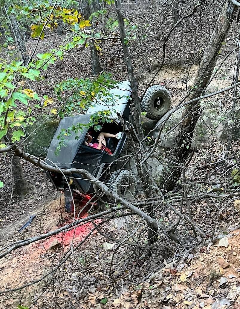 Jeep climbing a steep wooded line